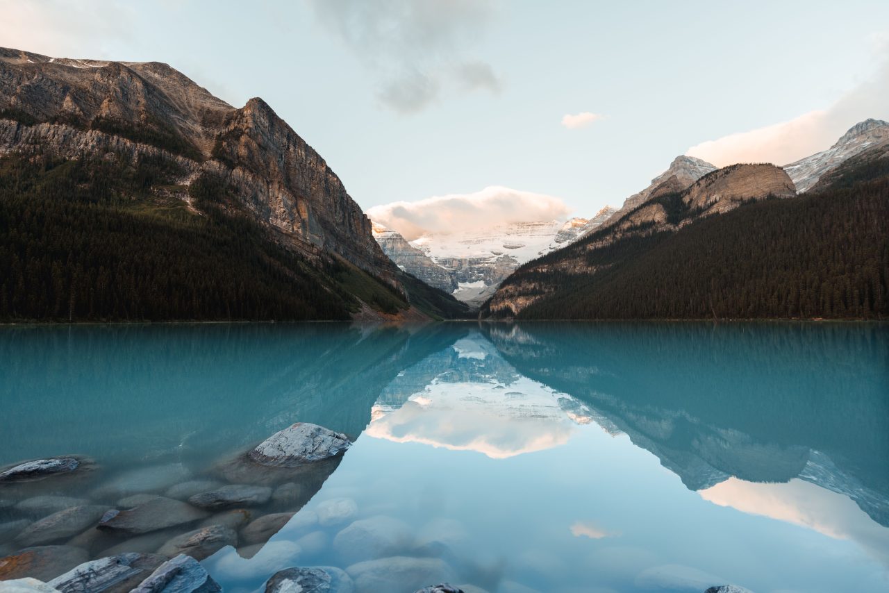 Lake Louise and the Canadian Rockies reflected in calm water, Banff National Park